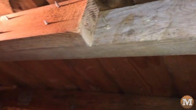 2x4 rafter "sistered" to a new one, then section removed for clearance