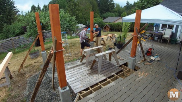 setting the pavilion posts in their galvanized saddles