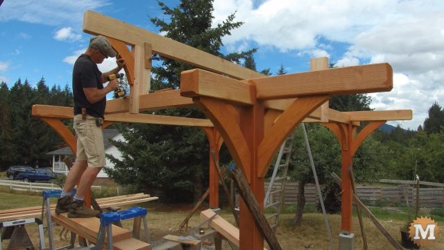installing a brace on the Three Gable Timber Frame style Pavilion ridge beam
