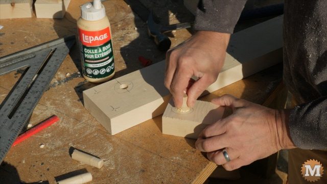 gluing a wooden dowel in the end assembly