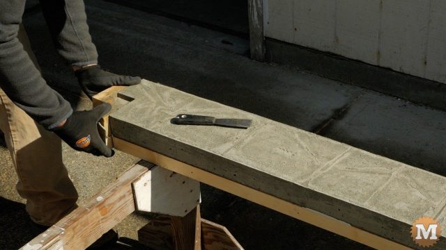 stripping the form from the concrete casting