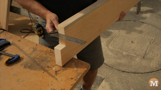 using a square to check the cut on the form base