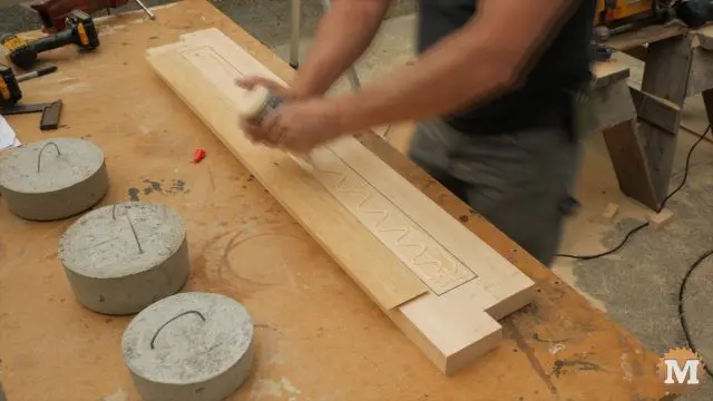 Inset is glued to base and held in place with weights