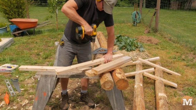 constructing the Raspberry Trellis from cedar posts and 2x4\'s