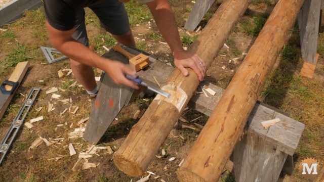 chiseling the Raspberry Trellis from cedar posts and 2x4\'s
