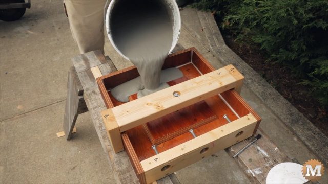 pouring the concrete into a form