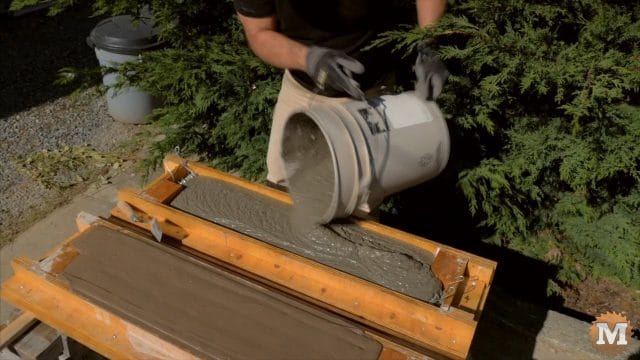 pouring the wet concrete aircrete mix into the form