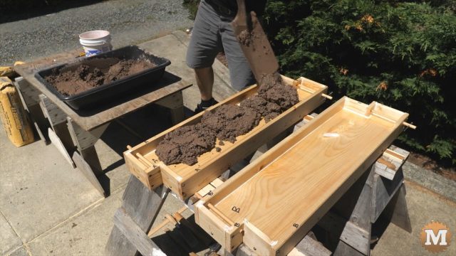 DIY Concrete Garden Bed Easy Form - Shovel wet concrete into form