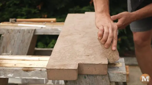 Remove sharp edge of casting with brick