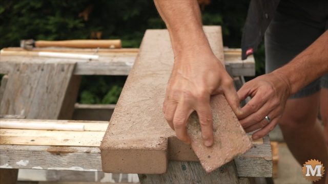 DIY Concrete Garden Box Easy Form - Remove sharp edge of casting with brick