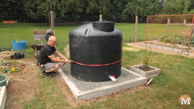 Setting 500 gallon rainwater tank in place