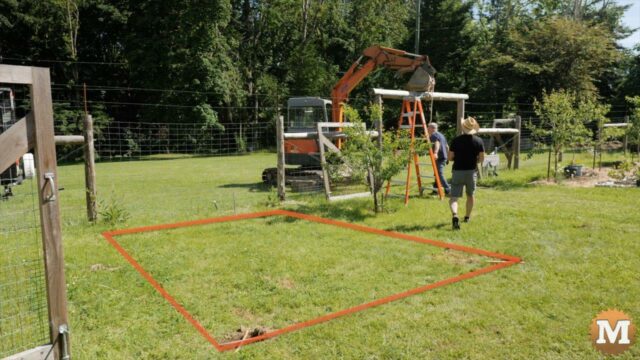 Greenhouse excavation lines marked on garden lawn