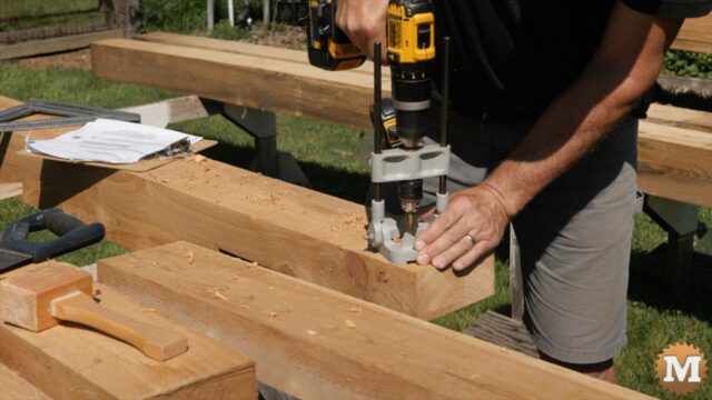 Using a drill guide for pilot holes in a beam scarf joint