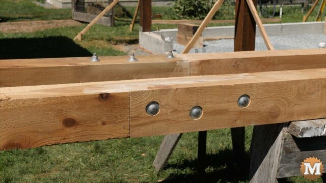 Bolted scarf joint in 6x6 cedar beams for timber frame greenhouse