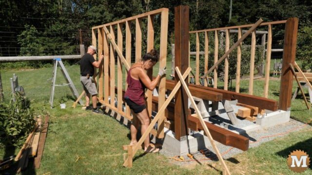 Lifting a greenhouse stud wall into place
