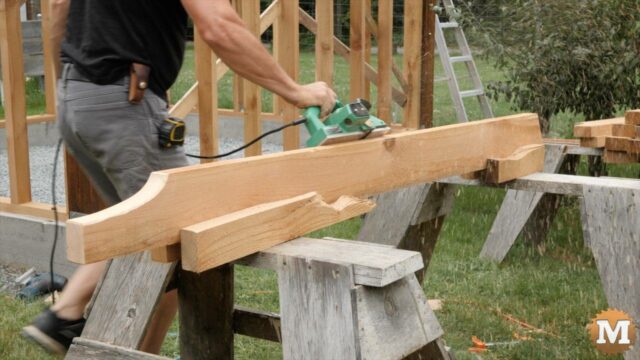Chamfering the edge of a cedar rafter with a power plane