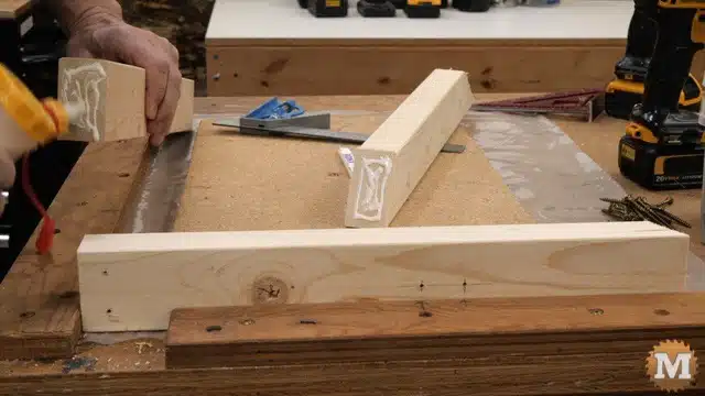 Applying glue to the shelf bracket parts