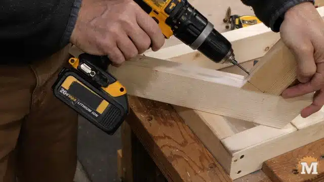 Drilling a pilot hole using and improvised DIY drill block