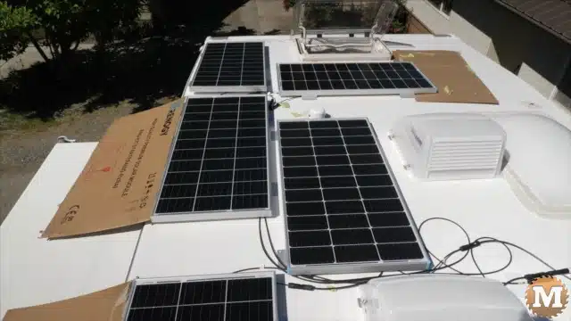 Uncovered solar panels on the roof of the truck camper