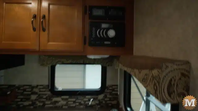 Remote power switch and battery monitor in kitchen of camper