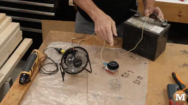 a radiator fan thermostat wired to a test battery and fan