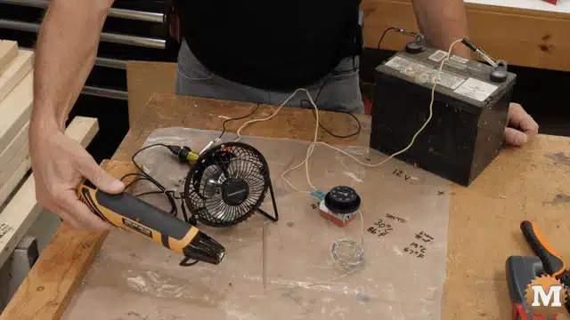 heating the thermostat probe to trigger the fan