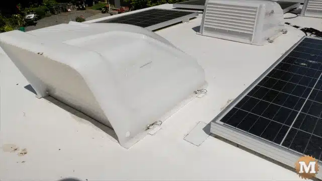 RV roof showing vent covers and solar panels