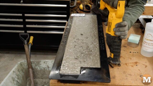vibrating the workbench with a bladeless reciprocating saw to settle the concrete