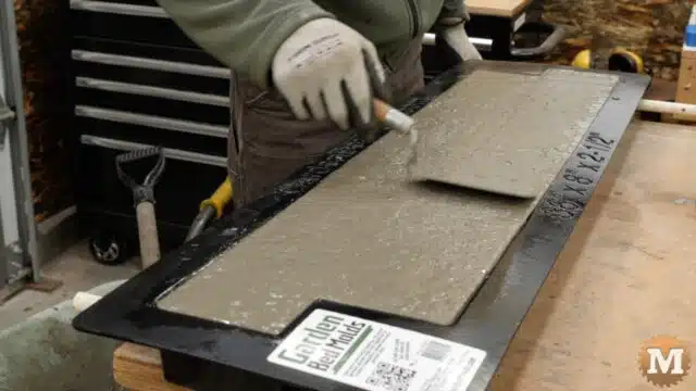 a small trowel is used to smoth the surface of the concrete