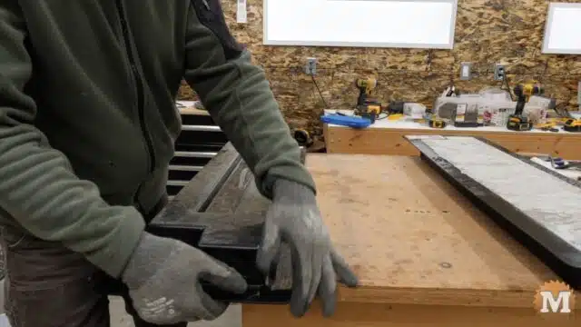 gently flexing the plastic mold from end to end to free the casting