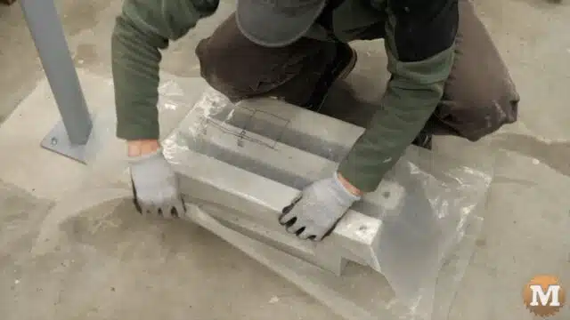 wrapping the wet concrete panels in thick plastic to slow the drying process