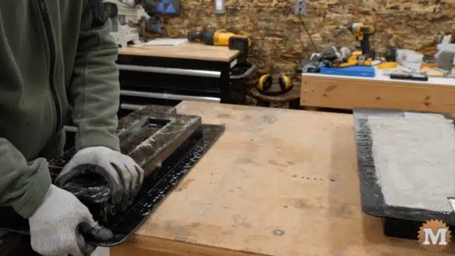 apply an alternating lifting technique to free the concrete casing from the plastic mold