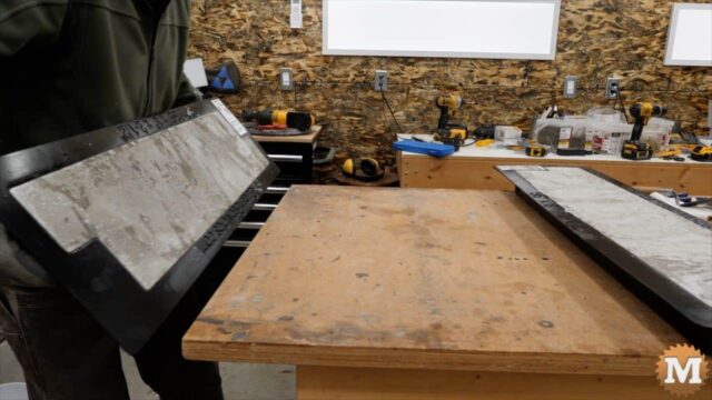 rotating the mold upside down onto a workbench